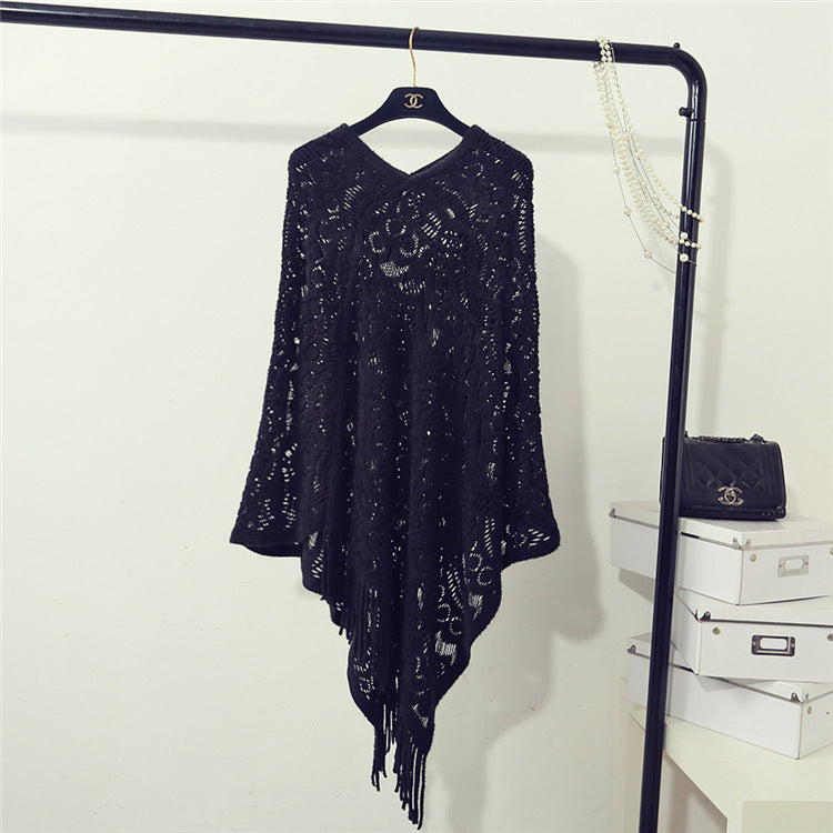 Stickad virkad ihålig oregelbunden tröja med tofsar för kvinnor