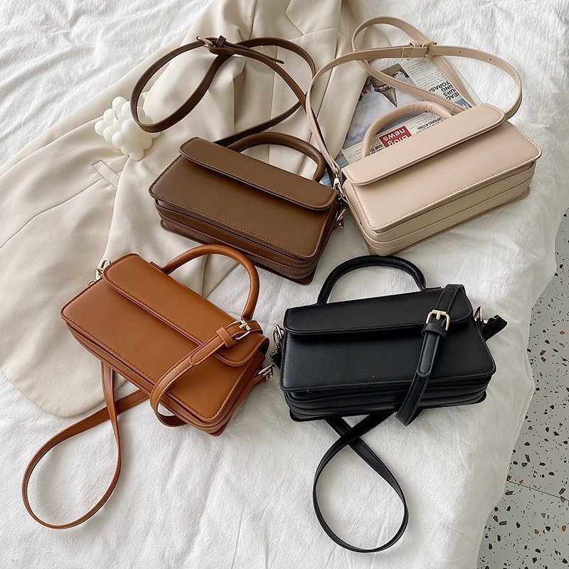 Retro texturerad enfärgad enkel handhållen mångsidig axelväska