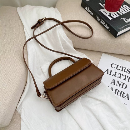 Retro texturerad enfärgad enkel handhållen mångsidig axelväska