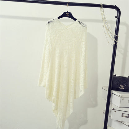 Stickad virkad ihålig oregelbunden tröja med tofsar för kvinnor