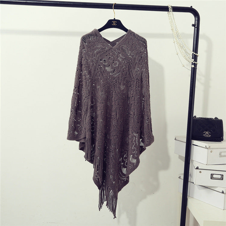 Stickad virkad ihålig oregelbunden tröja med tofsar för kvinnor