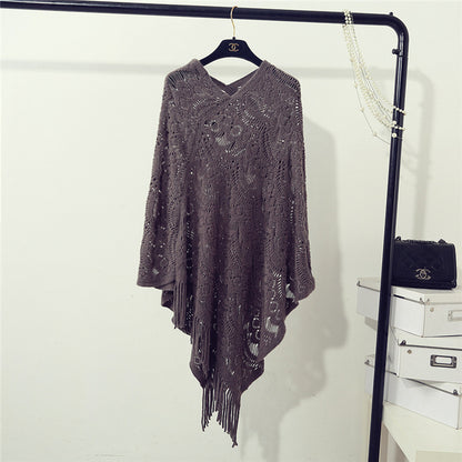 Stickad virkad ihålig oregelbunden tröja med tofsar för kvinnor