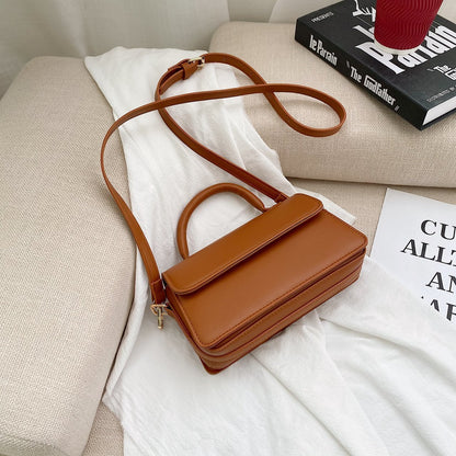 Retro texturerad enfärgad enkel handhållen mångsidig axelväska