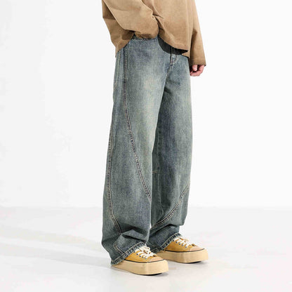 Herrjeans med vida ben och slitna detaljer