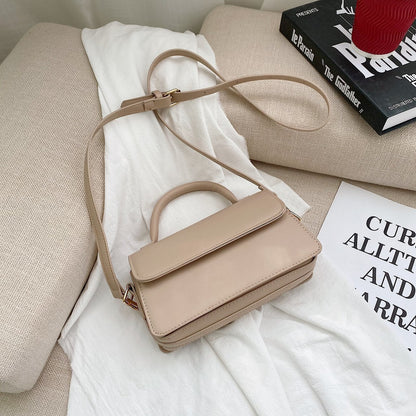 Retro texturerad enfärgad enkel handhållen mångsidig axelväska